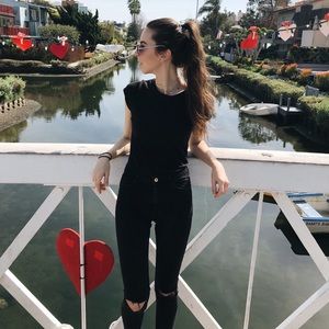 H&M black skinny jeans with busted knees